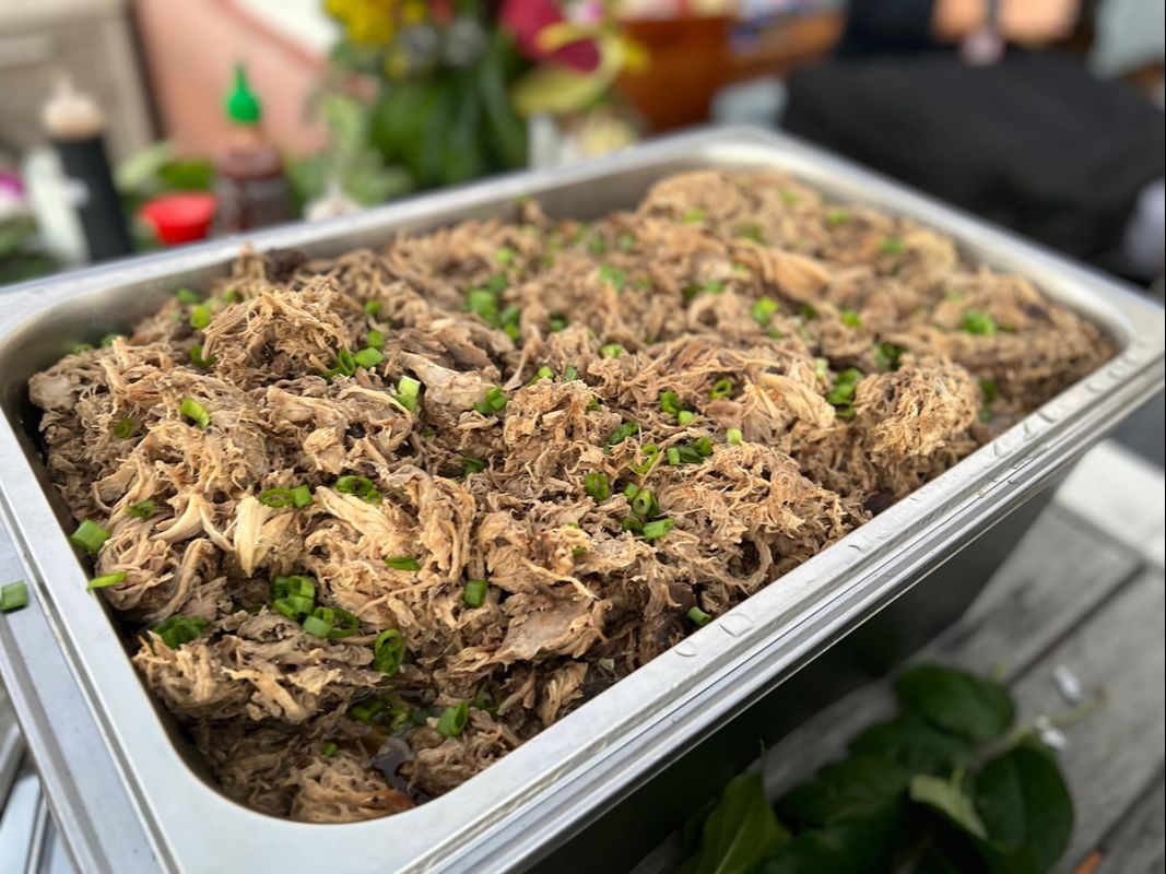Southern California's authentic and homemade kalua pulled pork, served over freshly chopped cabbage, green onions, and teriyaki sauce. The pork is baked on low heat for hours to keep a tender, juicy texture, and hold that Hawaiian flavor